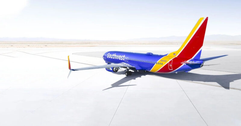 Southwest Airlines jet parked on tarmac set against light background Used as featured image for Southwest bonus offers and promotions.