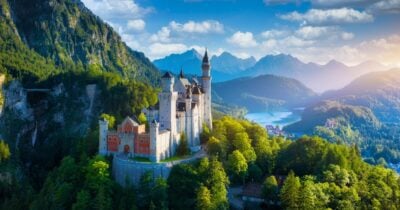 Neuschwanstein Castle with scenic mountain landscape in Hohenschwangau, near Fussen, Bavaria, Germany.