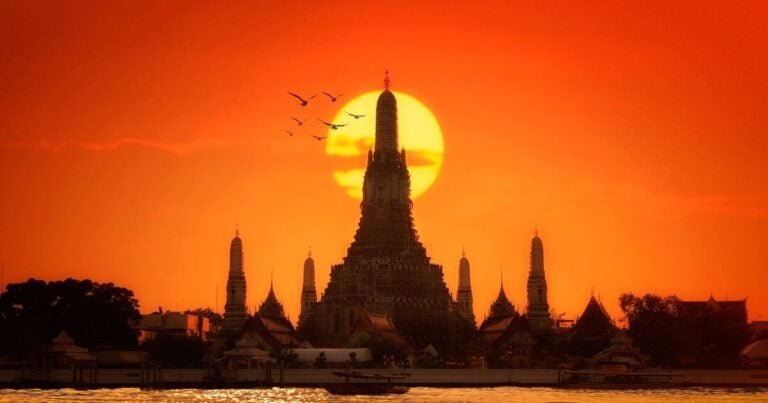 Golden hour at Wat Arun, Bangkok; a prime destination for budget-luxury travelers in Thailand.