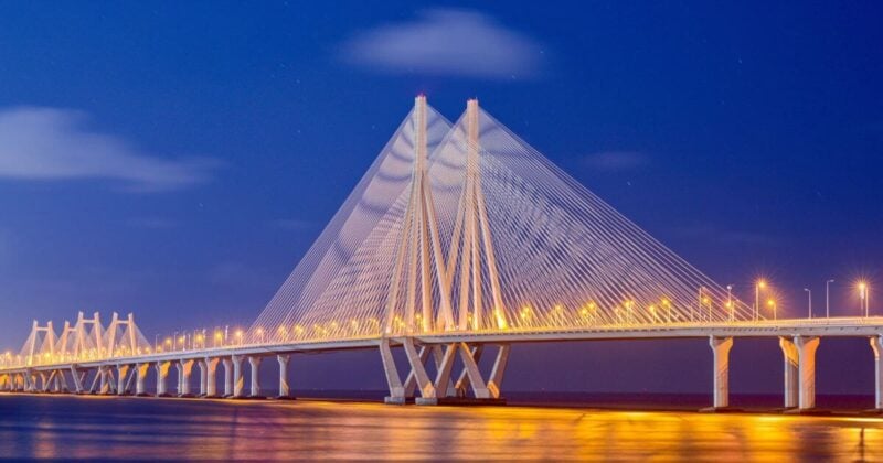 Illuminated Bandra-Worli Sea Link cable bridge spanning the Arabian Sea in Mumbai, India, at night.