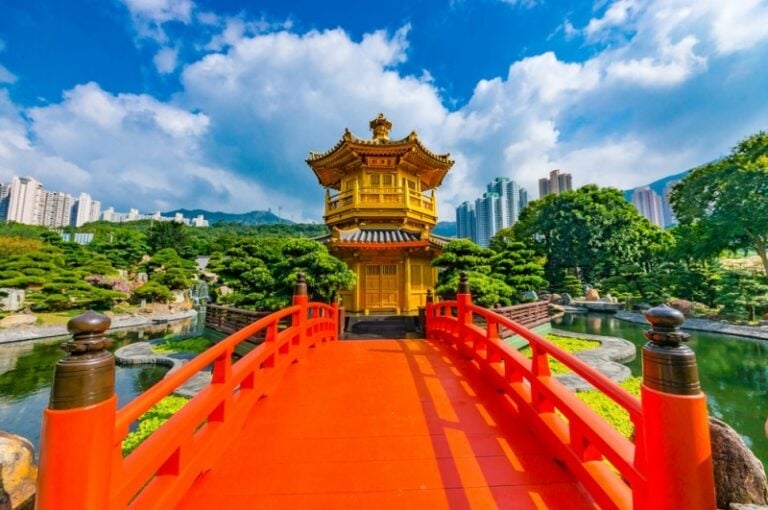 Golden Chinese pagoda with bright orange bridge leading to it