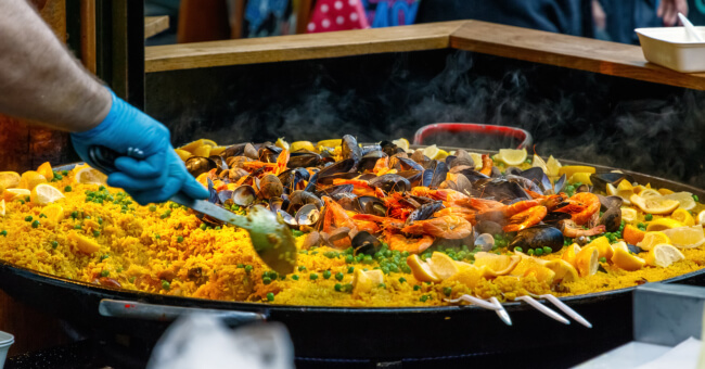 Extra large pan brimming with seafood paella at the Borough Market in London